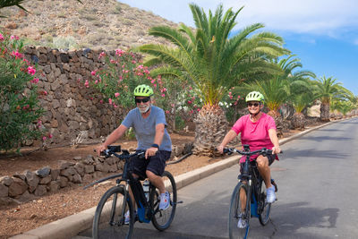 Portrait of people riding bicycle