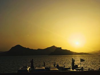 Scenic view of sea against orange sky