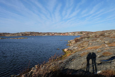 Scenic view of sea against blue sky