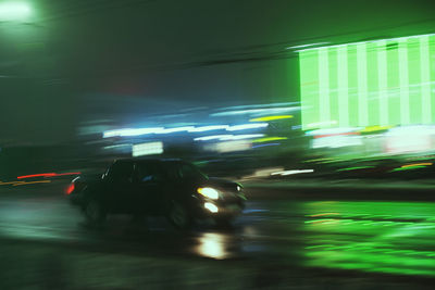 Blurred motion of vehicles on road at night