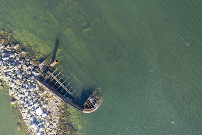 High angle view of abandoned floating on sea