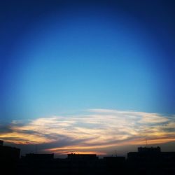 Low angle view of built structure against sky at sunset