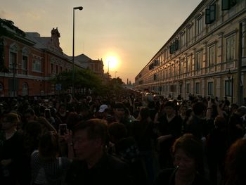 Group of people in front of buildings