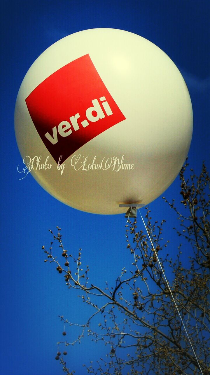 low angle view, blue, clear sky, close-up, red, illuminated, circle, communication, sky, night, lighting equipment, no people, text, sphere, outdoors, copy space, balloon, moon, dusk