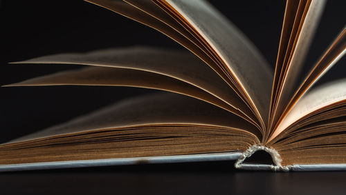 Macro, sheets of the book on a black background.