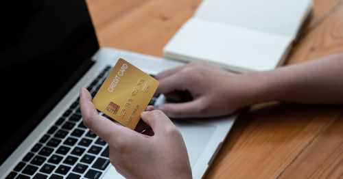 Midsection of woman holding hands