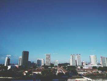 City lit up against blue sky