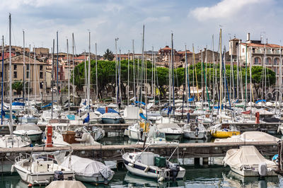 Boats moored at harbor