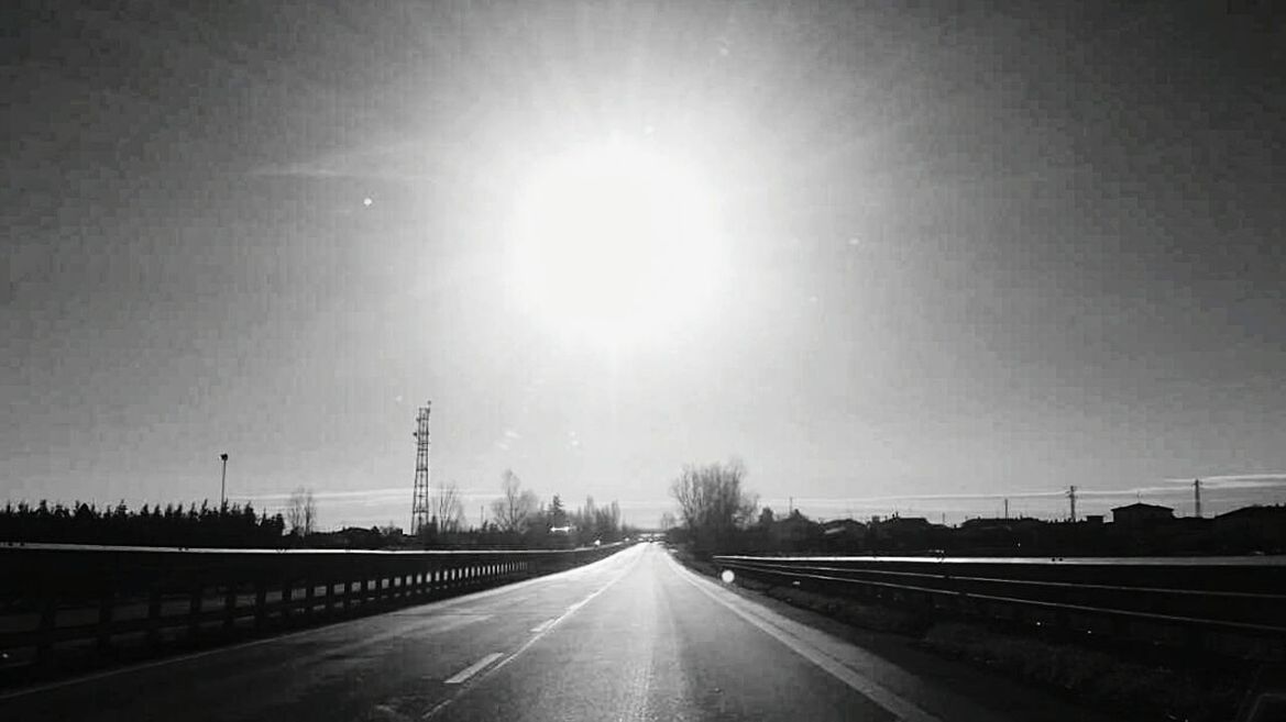 ROAD AGAINST SKY AND SUN