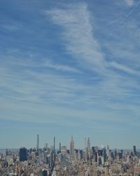 Modern buildings in city against sky