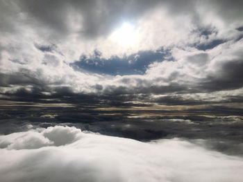 Sunlight streaming through clouds in sky