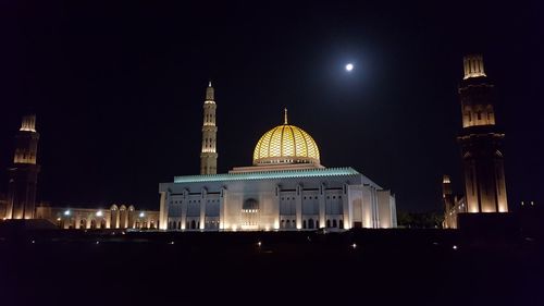 Illuminated cathedral against sky at night