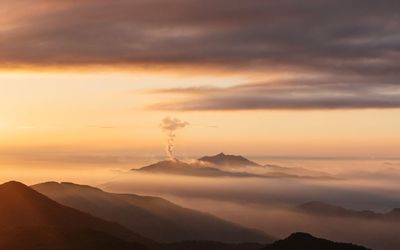 Scenic view of mountains at sunset