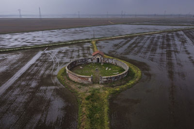 High angle view of tire tracks on road