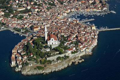 High angle view of townscape by sea