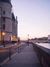 Road in city against clear sky