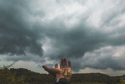 Low angle view of statue against cloudy sky