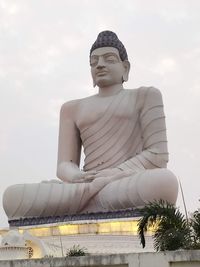 Low angle view of statue against sky