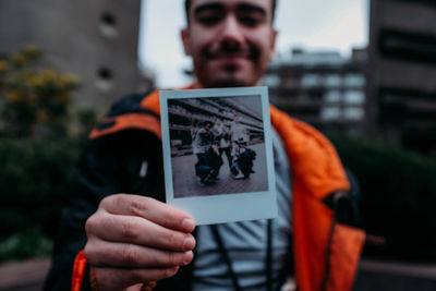 Close-up of man photographing