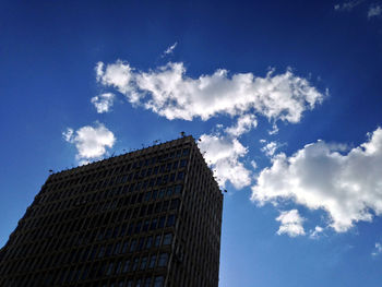 Low angle view of skyscraper against sky