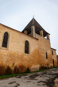 Low angle view of old building against clear sky