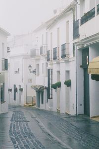 Street amidst buildings against sky