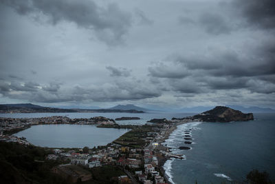 Panoramic view of sea and cityscape against sky