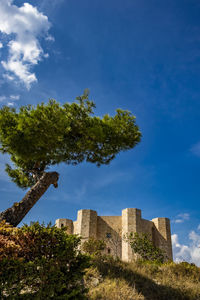 Low angle view of historic building against sky