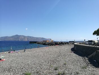 Scenic view of calm sea against blue sky