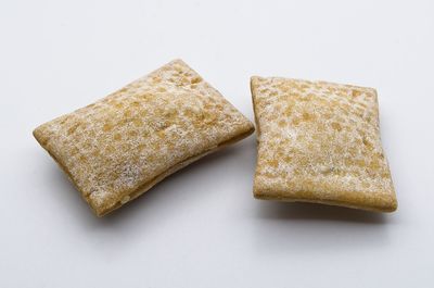 Close-up of cake against white background