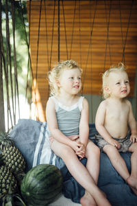 Brother and sister sitting together