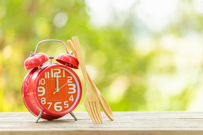 Close-up of clock on table