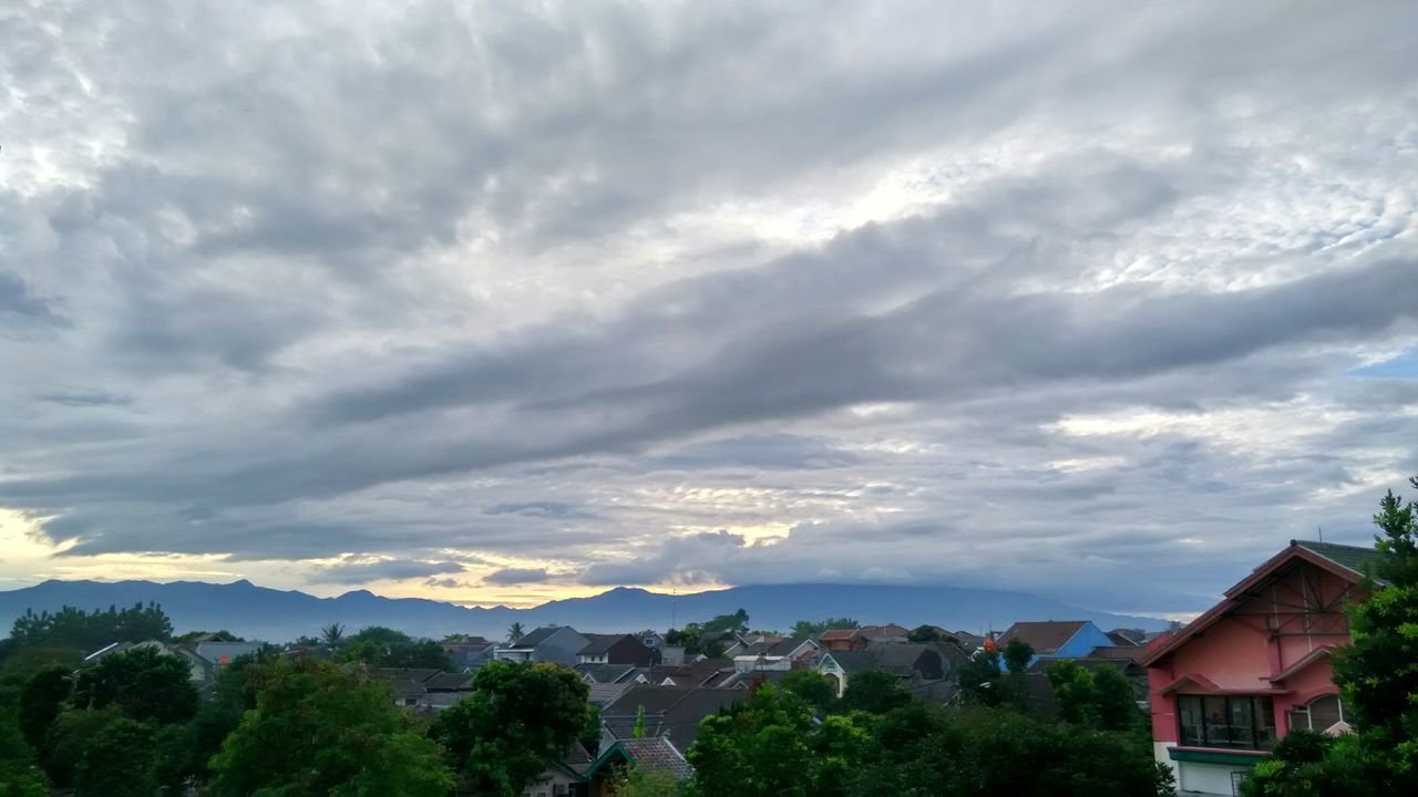 SCENIC VIEW OF MOUNTAINS AGAINST CLOUDY SKY