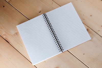 High angle view of open book on table