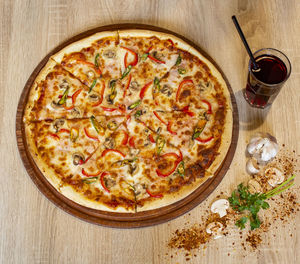 High angle view of pizza served on table