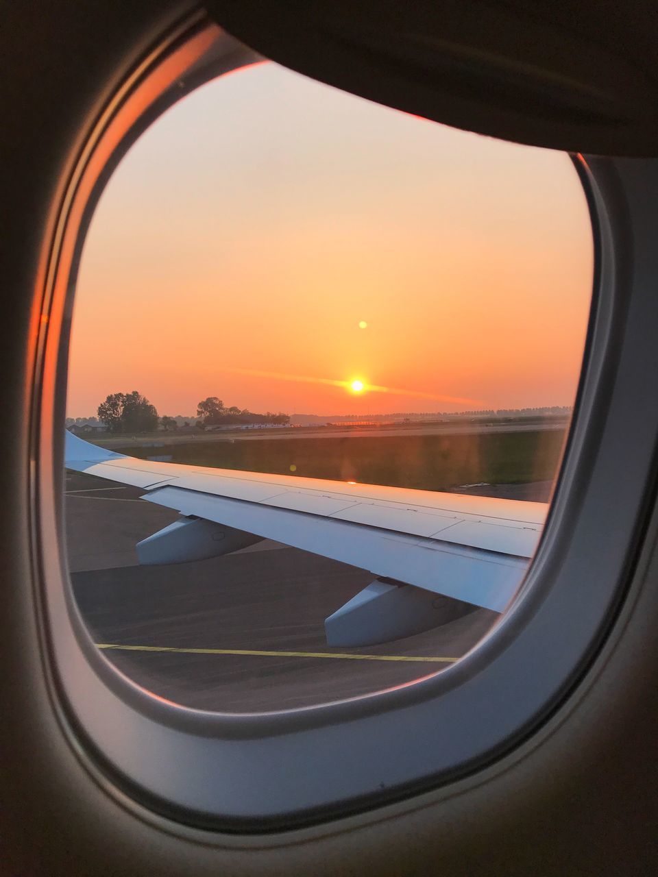 LANDSCAPE SEEN THROUGH AIRPLANE WINDOW