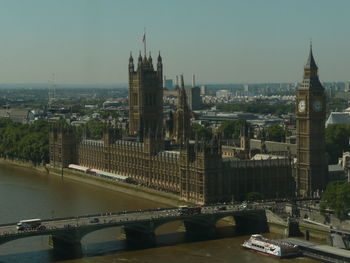 View of bridge over river and buildings in city