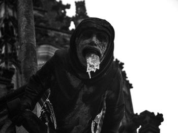 Portrait of man standing against trees