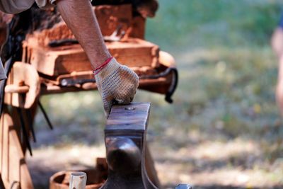 Close-up of man working on wood