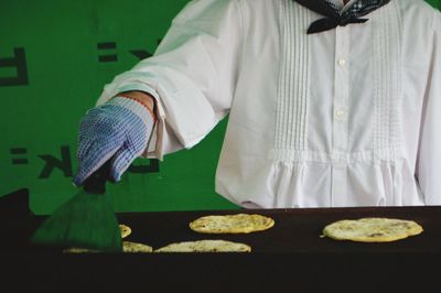 Low section of man standing on table