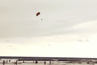 People paragliding in sky