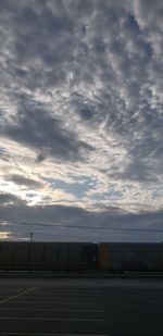 Road against dramatic sky during sunset