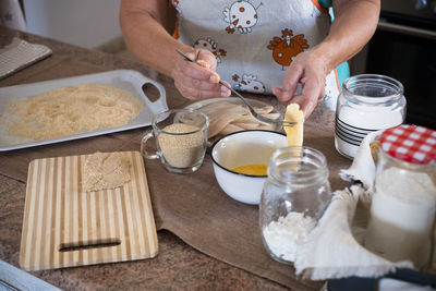 High angle view of person preparing food on table
