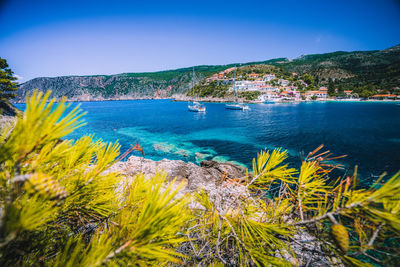 Scenic view of sea against clear blue sky