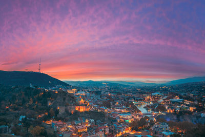 Aerial view of townscape against sky during sunset