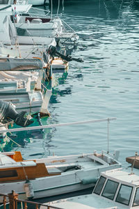 High angle view of sailboats moored at harbor