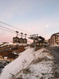 Construction site against clear sky during winter