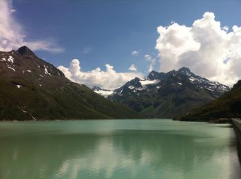 Scenic view of lake against cloudy sky