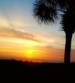 Scenic view of sea against sky at sunset