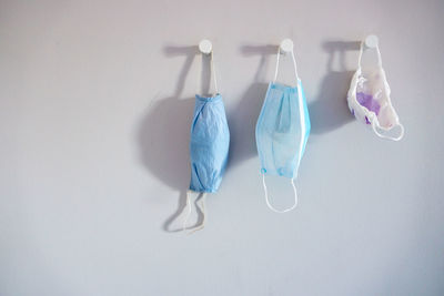 Close-up of clothes hanging on white background